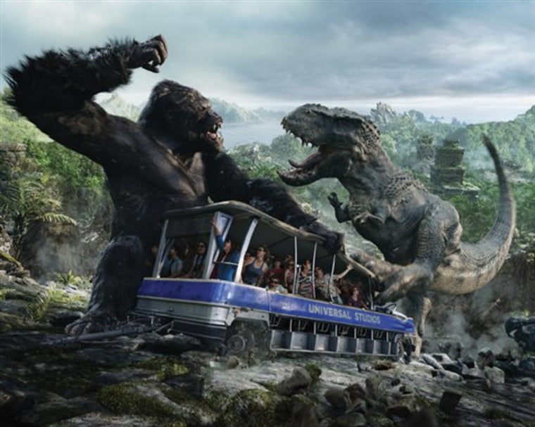 King Kong battles a dinosaur in a scene from the new attraction "King Kong 360 3-D," created by Peter Jackson.